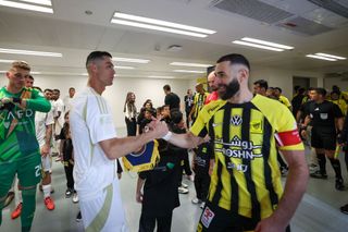 JEDDAH, SAUDI ARABIA - DECEMBER 6: Cristiano Ronaldo of Al Nassr and Karim Benzema of Al Ittihad talk prior the Saudi Pro League match between Al-Ittihad v Al-Nassr at King Abdullah Sports City on December 6, 2024 in Jeddah, Saudi Arabia. (Photo by Yasser Bakhsh/Getty Images)