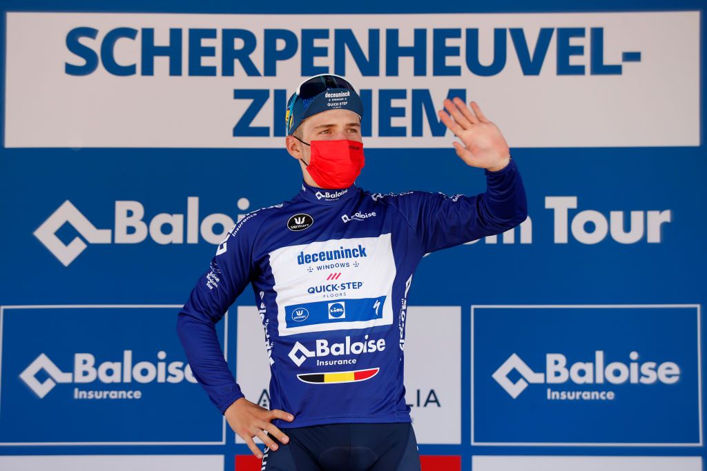 SCHERPENHEUVELZICHEM BELGIUM JUNE 11 Remco Evenepoel of Belgium and Team Deceuninck QuickStep Blue Leader Jersey celebrates at podium during the 90th Baloise Belgium Tour 2021 Stage 3 a 1744km stage from Gingelom to ScherpenheuvelZichem Trophy baloisebelgiumtour on June 11 2021 in ScherpenheuvelZichem Belgium Photo by Bas CzerwinskiGetty Images