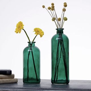 green glass bottles with flowers 