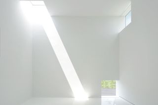 white interior with ray of light at Magazzino Italian Art