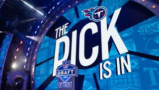 Text "The Pick Is In" and a Tennessee Titans logo on a big screen at the 2024 NFL Draft