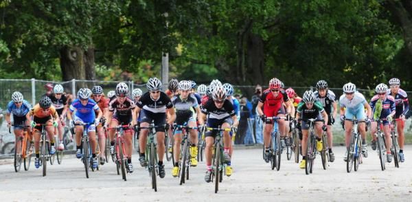The elite women's start on the pavement.