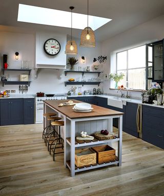 Country kitchen diner breakfast bar at kitchen island in blue and grey kitchen