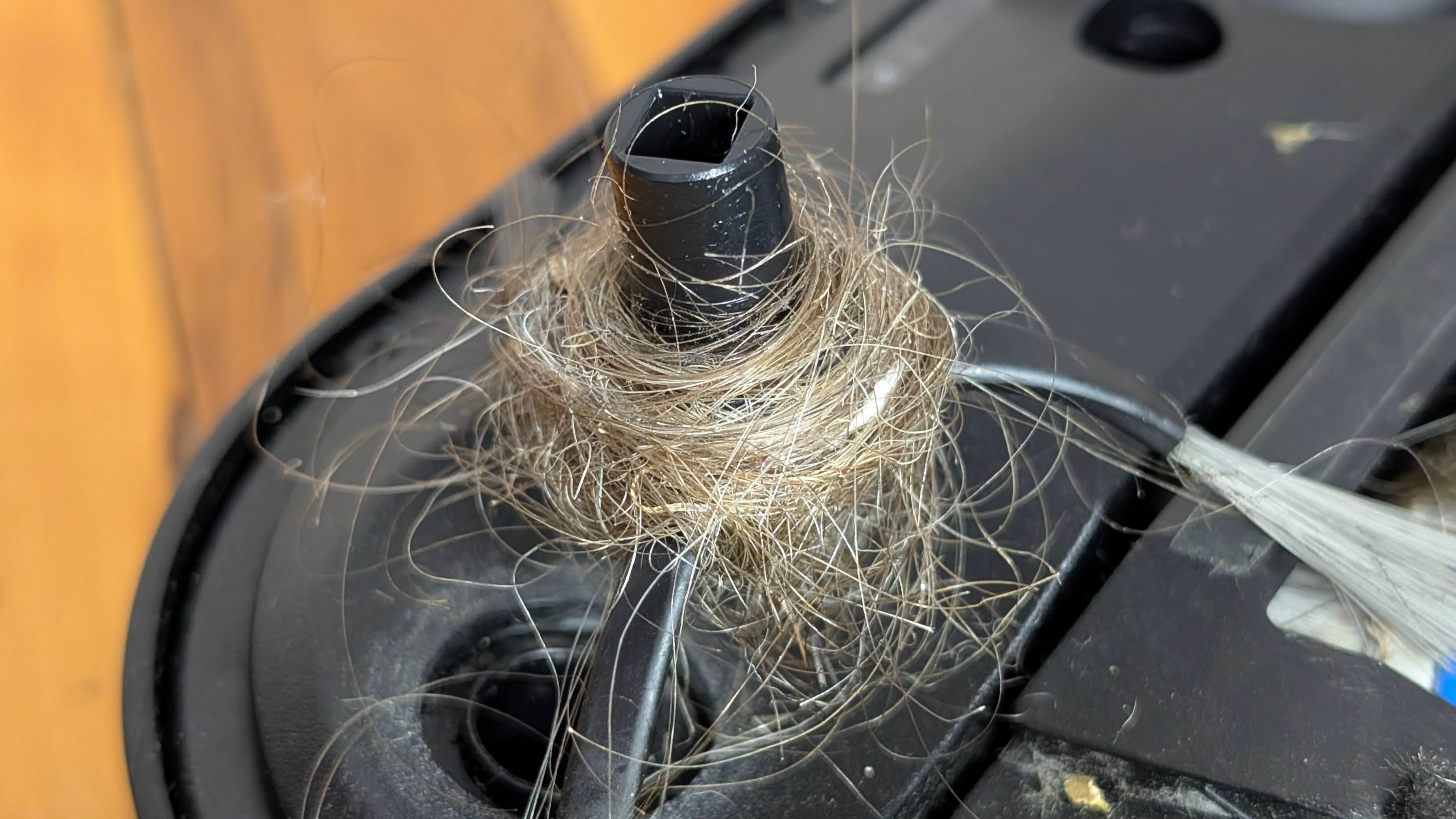 Ecovacs X5 Pro Omni side brush removed showing hair