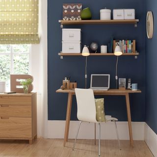 open shelf with wooden table table and chair
