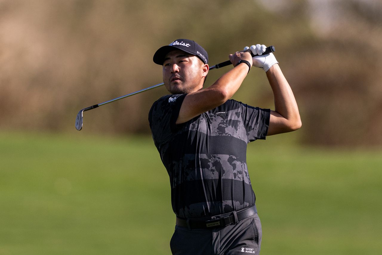 Richard T Lee hits a wedge shot