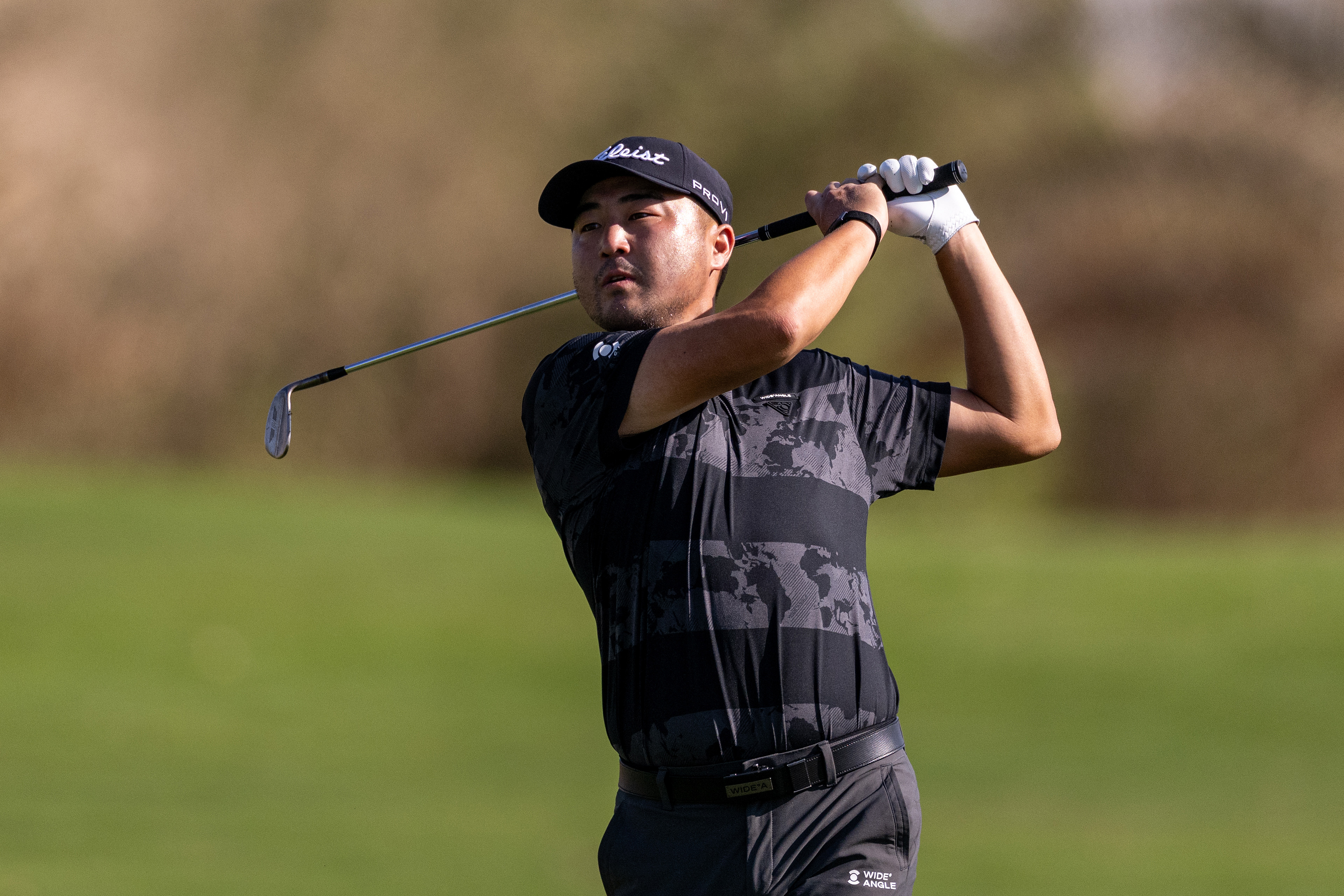 Richard T Lee hits a wedge shot