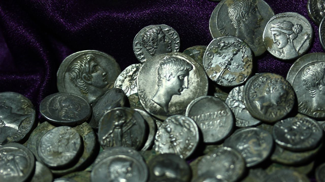 The coins featured Roman emperors on one side.