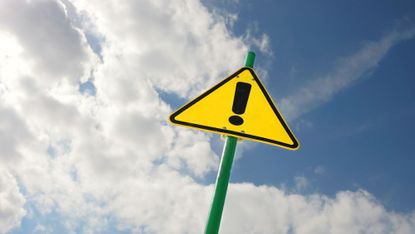 Yellow warning sign with an exclamation mark.