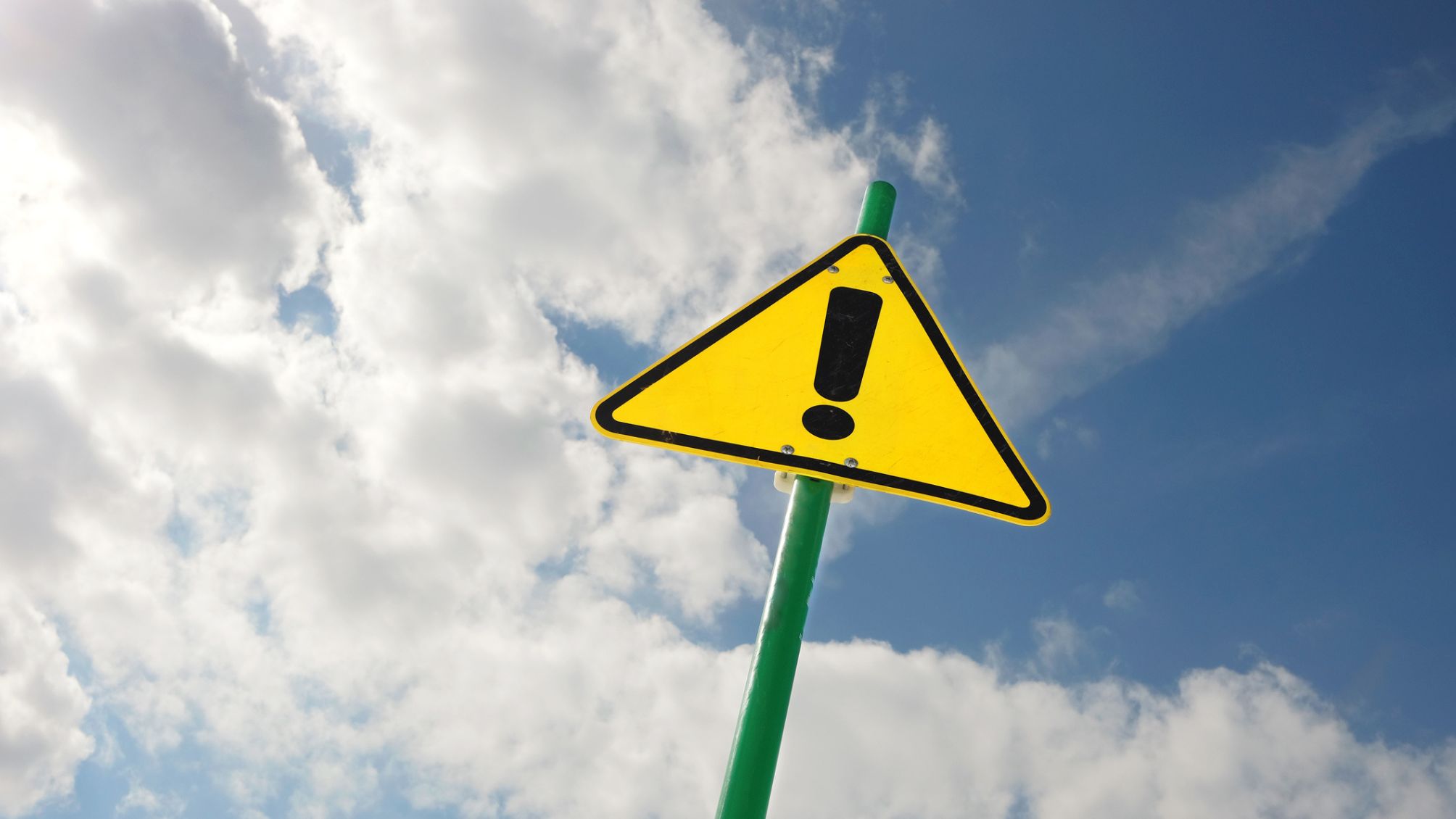 Yellow warning sign with an exclamation mark. 