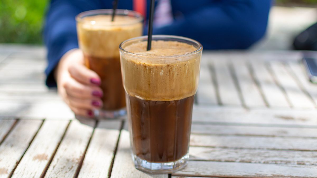 Two glasses of frappe coffee on a table