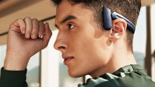 Man wearing mu6 bone conduction headphones
