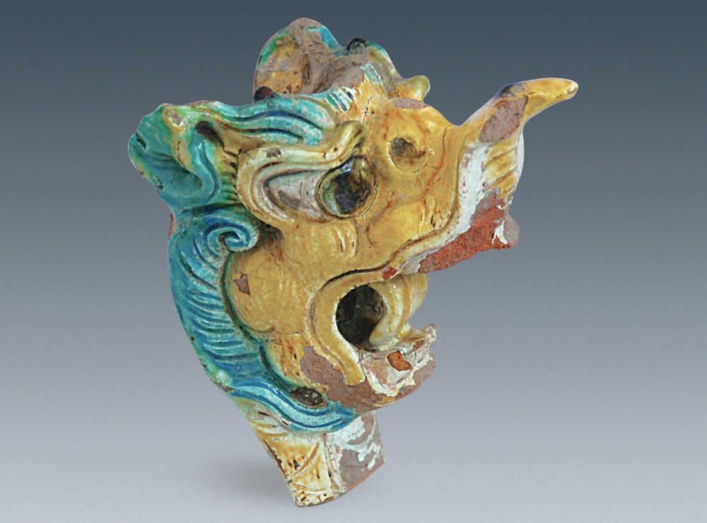 A colorful dragon head made of clay was found in a palace at Xanadu.