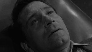 A man falling asleep in the Twilight Zone episode Perchance to Dream