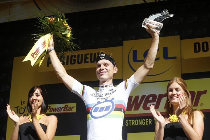 Tony Martin (Omega Pharma-QuickStep) lifts his arms in a victory salute after winning stage 20