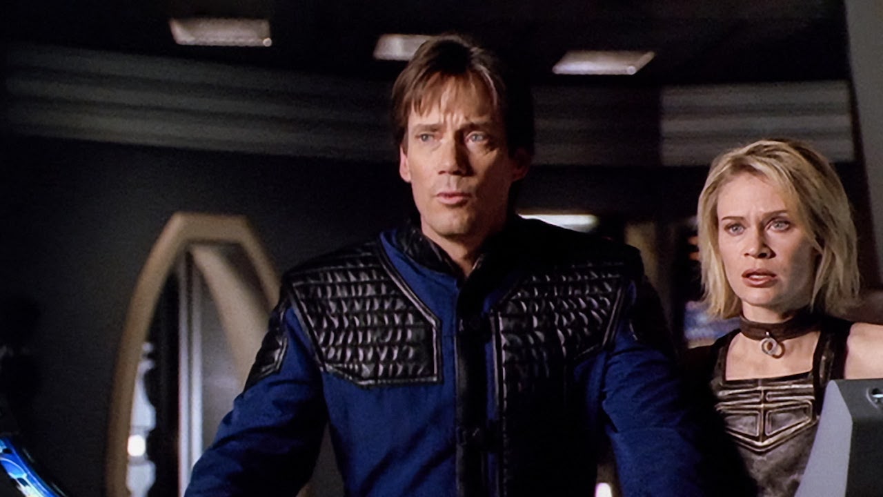 a man and a woman on a spaceship in a tv series