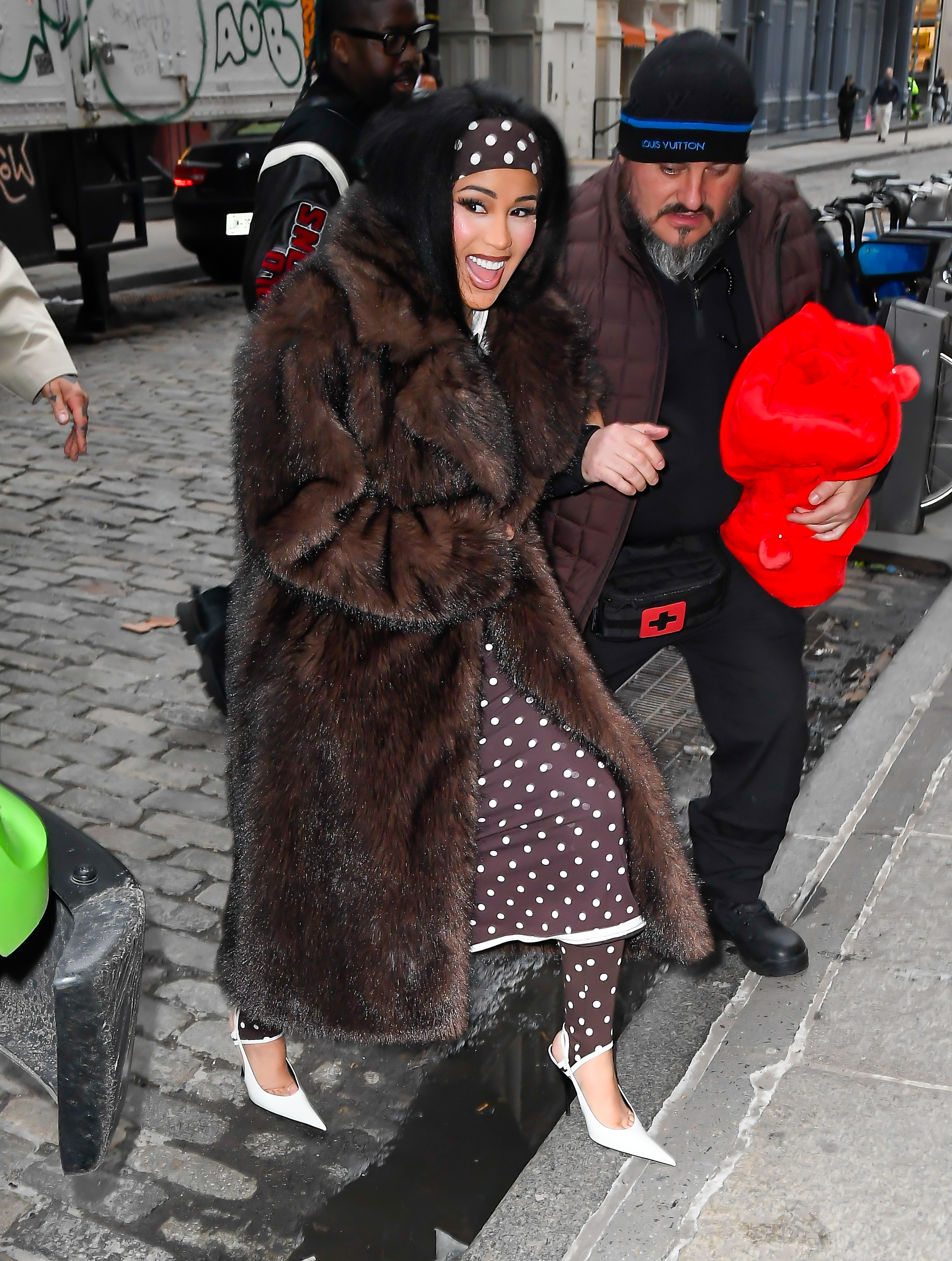 Cardi B was seen in New York City wearing a polka-dot take on the stirrup leggings trend, a matching dress, and headband