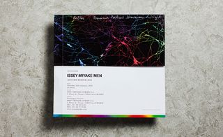 A poster-sized invitation printed with a rainbow of neon veins