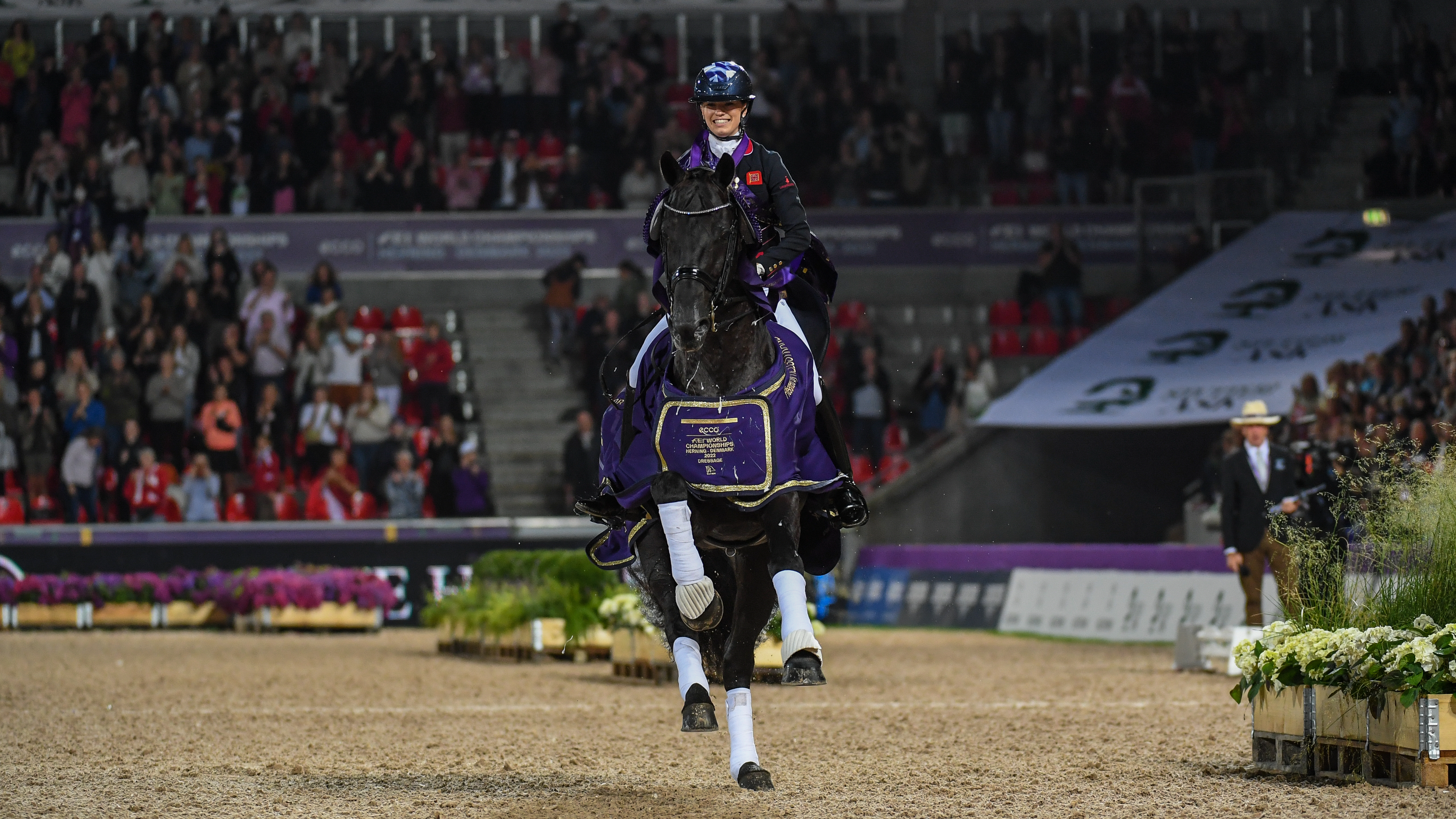 Lottie Fry and Glamourdale on their lap of honour after winning the grand prix freestyle at the World Dressage Championships in Herning