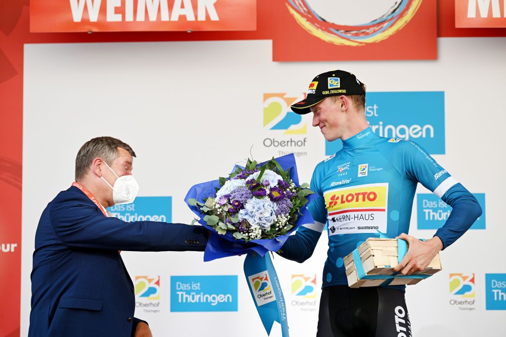 MEININGEN GERMANY AUGUST 25 Jakob Gener of Germany and Team Lotto Kern Haus celebrates winning the Polka dot mountain jersey on the podium ceremony after the 37th Deutschland Tour 2022 Stage 1 a 1717km stage from Weimar to Meiningen DeineTour on August 25 2022 in Meiningen Germany Photo by Stuart FranklinGetty Images
