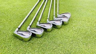 The Cobra Air-X Women’s Irons lying on the ground