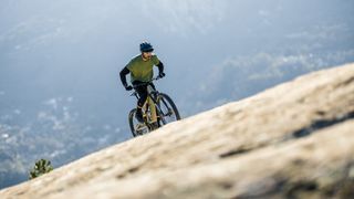 Rider climbing on the Canyon Neuron:ON CF