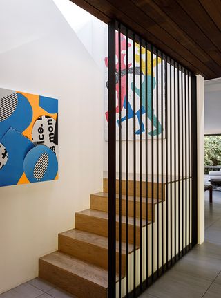 Contemporary staircase with bold colorful artwork