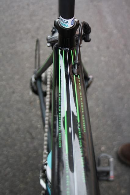 The top tube is decorated with thin green lines and dates that recall Cavendish's major career wins