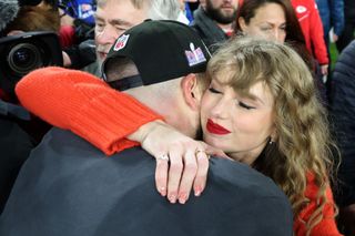 Travis Kelce #87 of the Kansas City Chiefs celebrates with Taylor Swift after a 17-10 victory against the Baltimore Ravens in the AFC Championship Game
