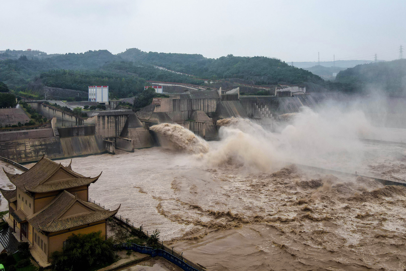 Aerial photo taken on July 19, 2020 shows water released from the Xiaolangdi Reservoir Dam in Luoyang in China's central Henan province, in preparation of the upcoming annual flood season at the Yellow River basin.