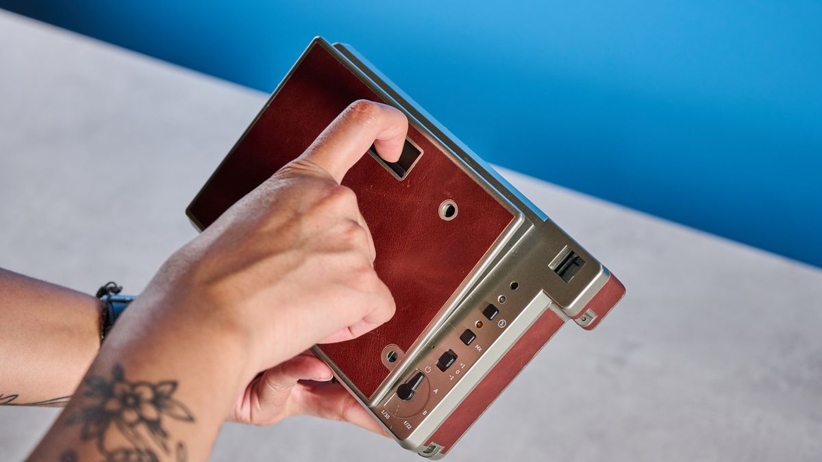 A brown Lomography Lomo'Instant Wide Glass instant camera