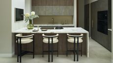 wood kitchen in U-shape layout with three stools 