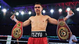 Tim Tszyu with belts on his arms, after victory over Bowyn Morgan