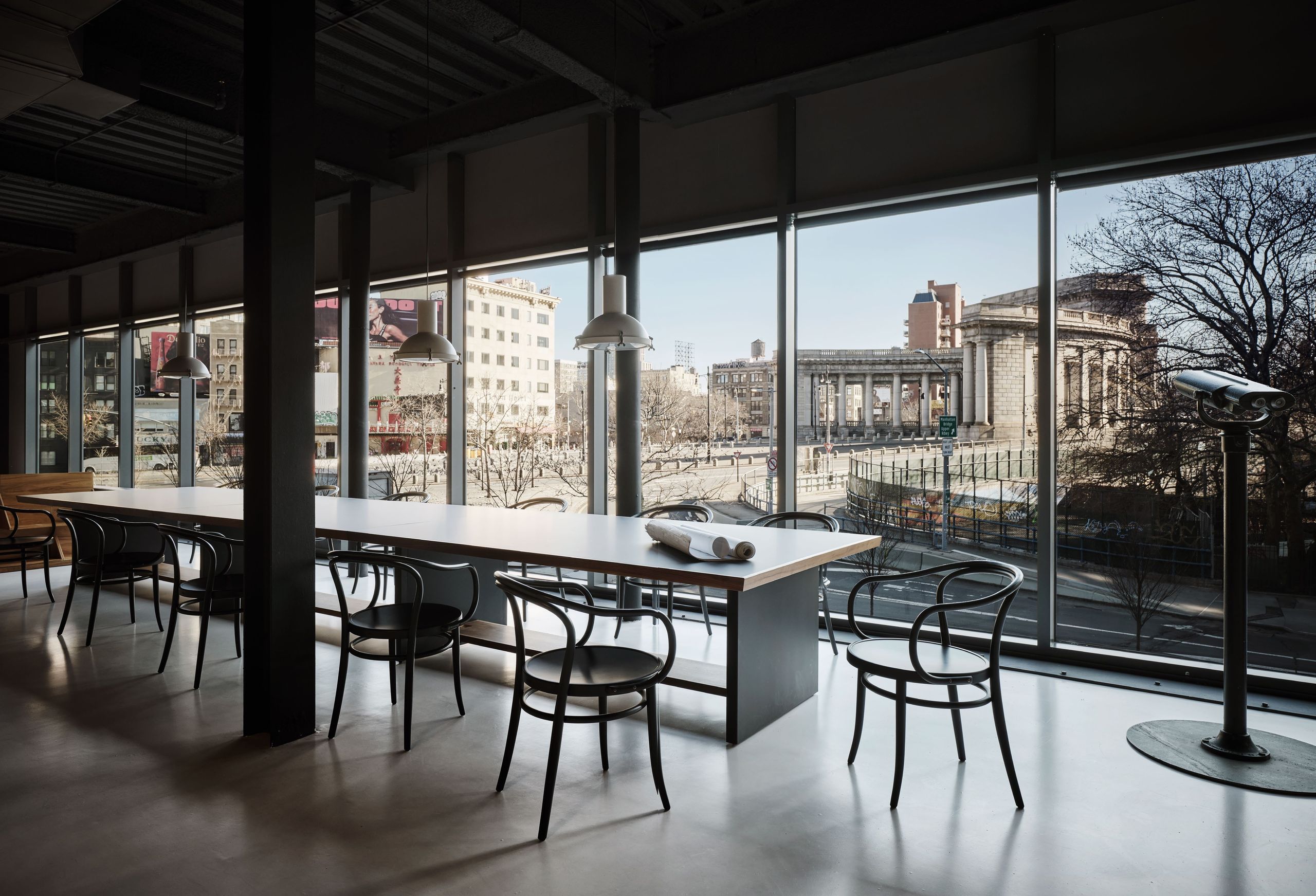 Bonetti Kozerski studio New York floor-to-ceiling windows framing Manhattan Bridge