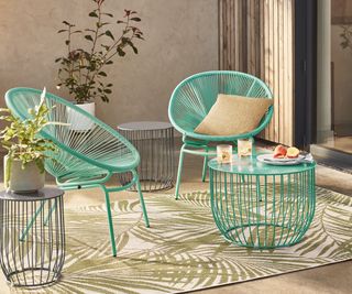 pale blue table and chairs on a balcony or patio