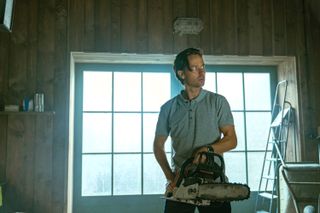 Tom Schilling as Björn Diemel with a chainsaw in Murder Mindfully