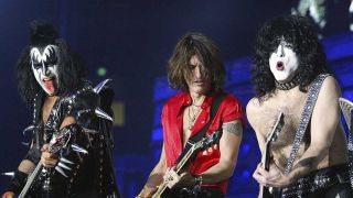 Joe Perry onstage with Kiss's Gene Simmons and Paul Stanley