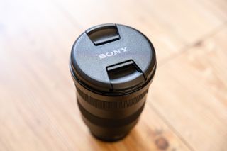 A camera lens with its lens cap on
