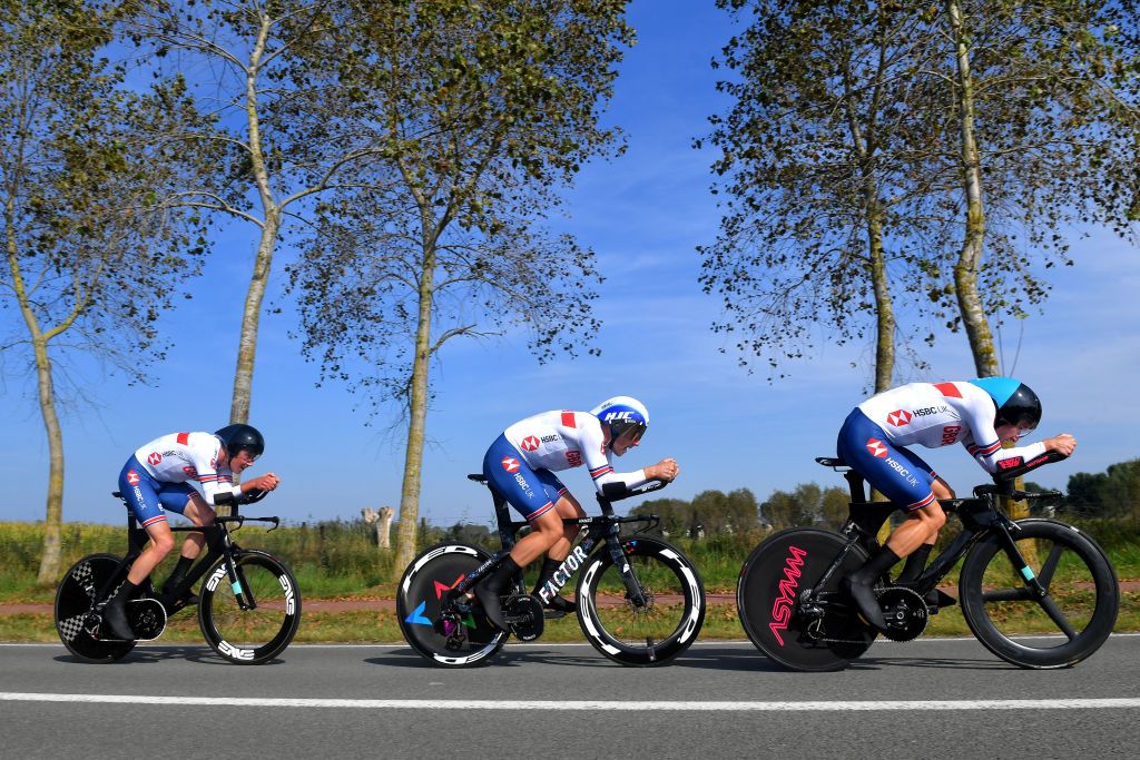 BRUGES BELGIUM SEPTEMBER 22 LR John Archibald of Great Britain Alex Dowsett of Great Britain and Daniel Bigham of Great Britain sprint during the 94th UCI Road World Championships 2021 Team Time Trial Mixed Relay a 445km race from KnokkeHeist to Bruges flanders2021 TT on September 22 2021 in Bruges Belgium Photo by Luc ClaessenGetty Images