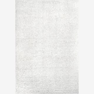A white colored shag rug