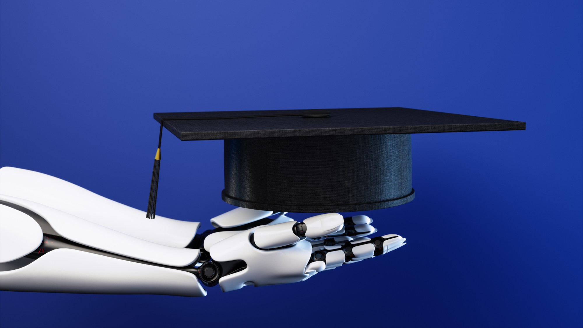 Robot hand holding graduation cap