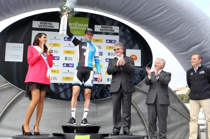 Theo Bos stands on the podium having won the opening stage of the 2013 Criterium International