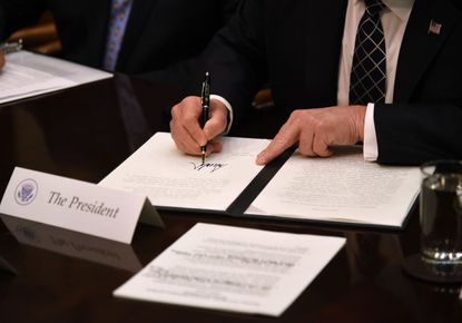President Trump signs executive order. 