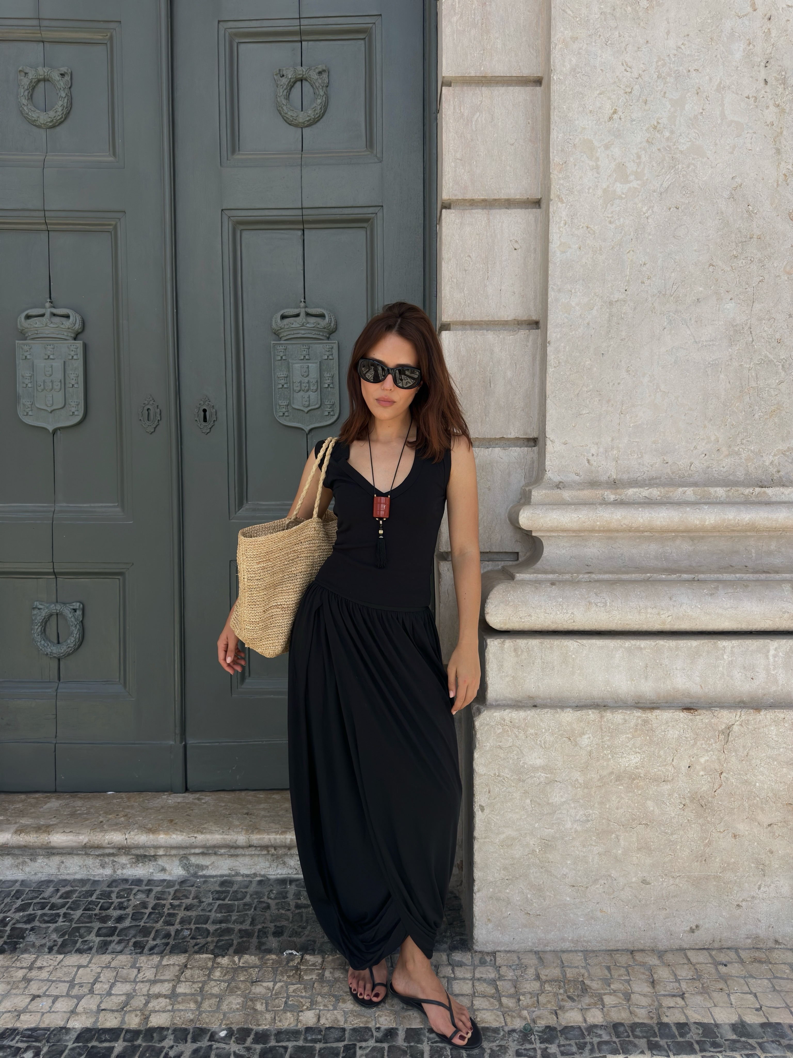 Influencer wearing a long pendant necklace