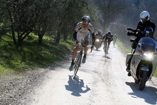 Michael Rogers (HTC - Columbia) powers away on Tuscan dirt roads.