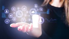 A woman's open hand, palm up with a digital representation of a network held above it