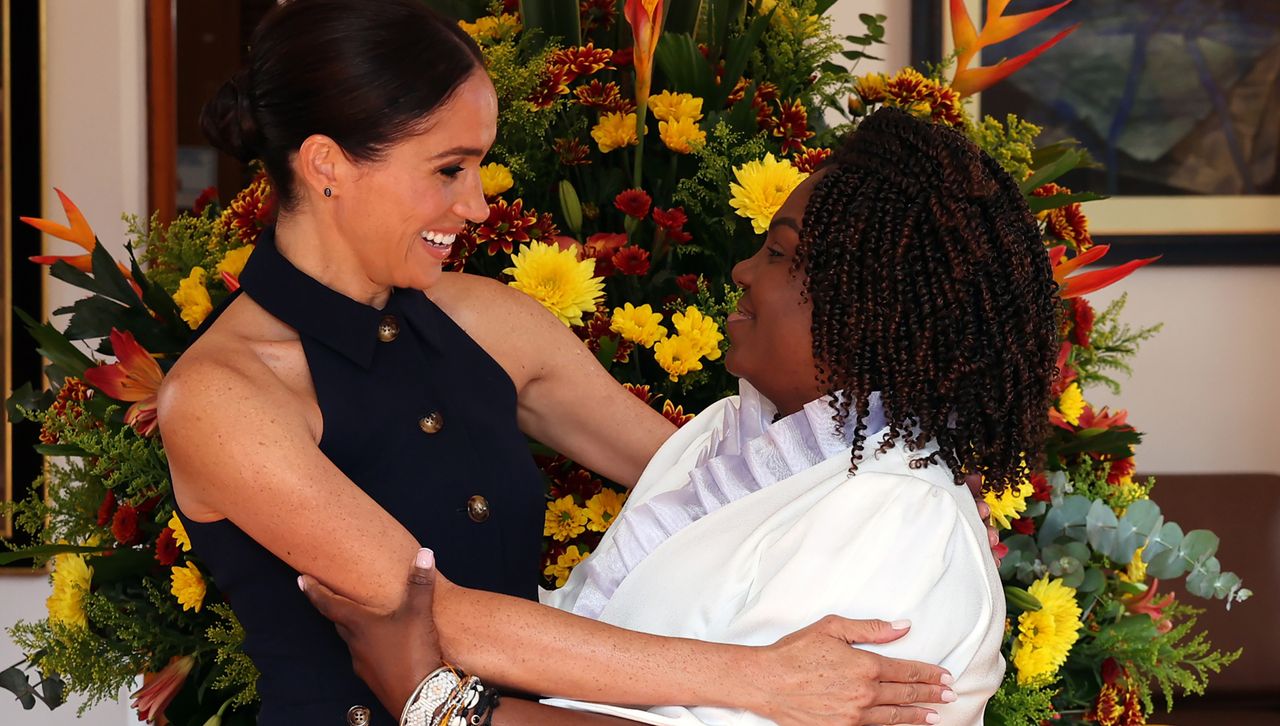 Meghan Markle hugs a woman in Colombia on royal tour