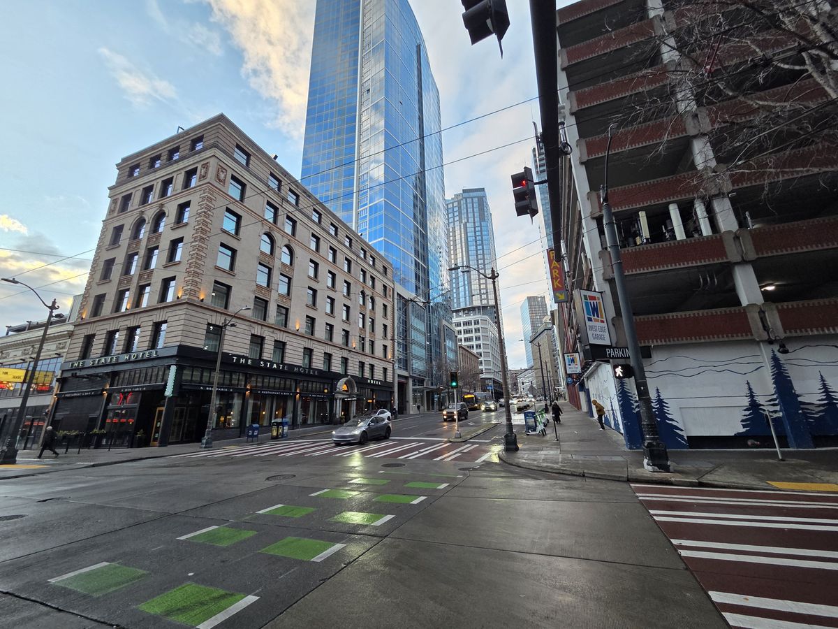 A street with buildings and cars
