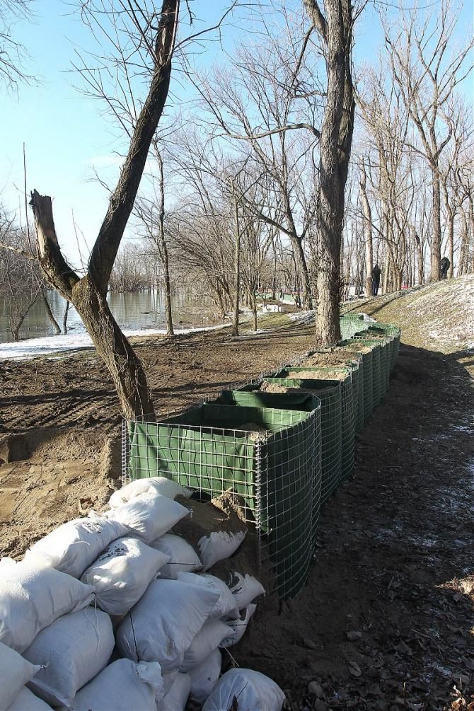 A remarkable amount of work is being done in a very short period of time as rising water threatens the 'cross Worlds course at Eva Bandman Park.