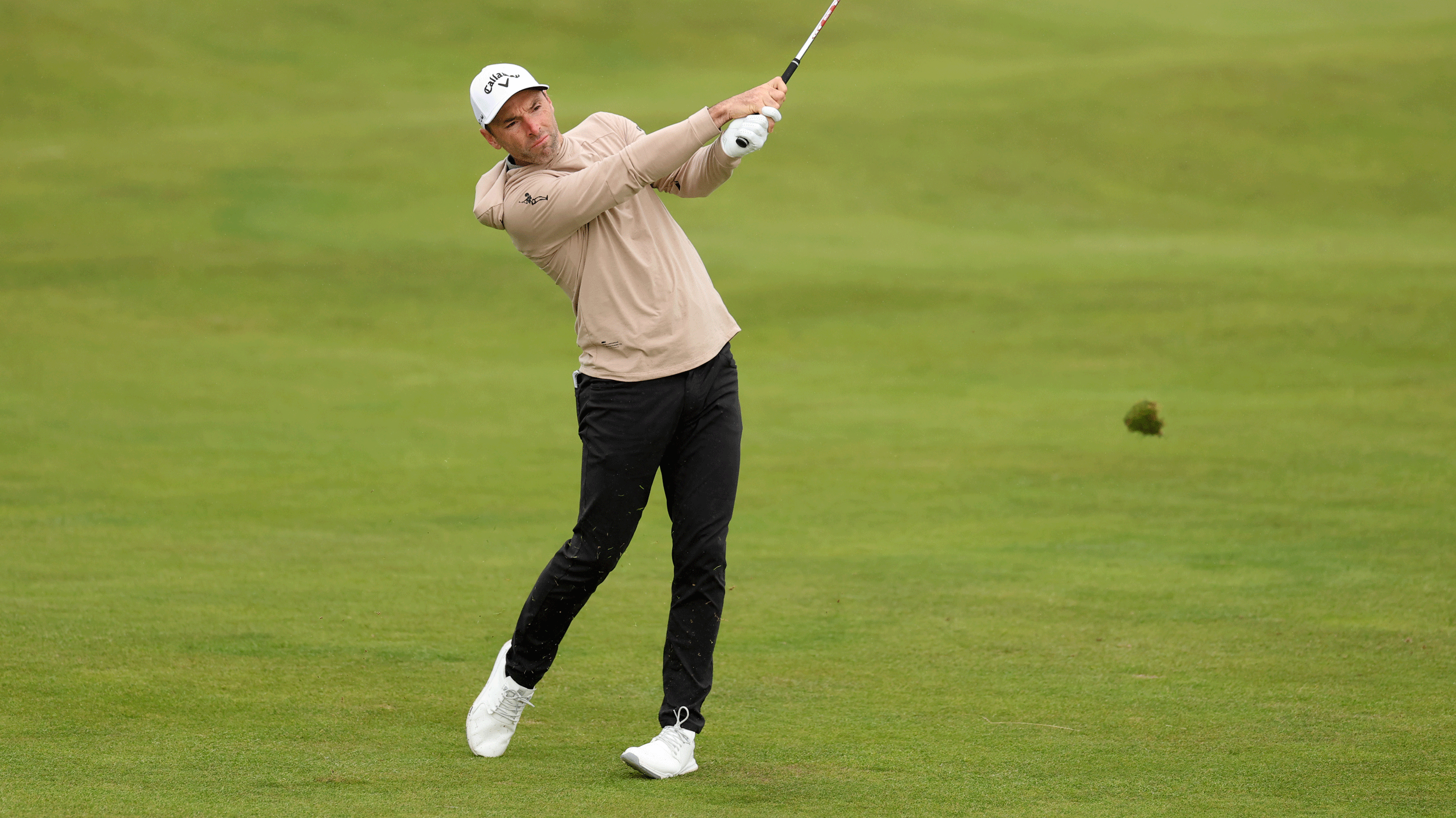 Oliver Wilson hits an iron shot during round two of the 2026 Alfred Dunhill Links Championship